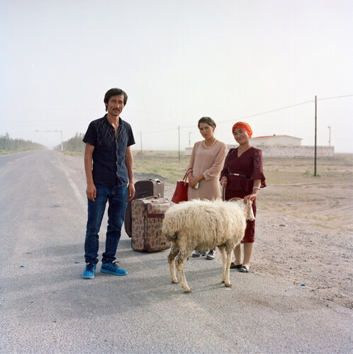 Figure 3. The day before the Corban Festival, three Uyghur youths waiting for transportation to their village. August, 2017.