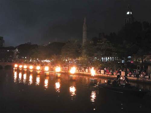 FIGURE 15 Thousands gather at summertime WaterFire festivals on the Woonasquatucket River, a revitalized former industrial waterway in Providence, Rhode Island. [Well-being] (Photo by Abbie Tingstad, 2019).