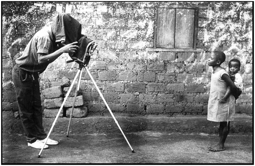 Figure 10 Samuel Finlak using an old sheet film camera. Atta village, Adamaoua Province, Cameroon, 1984. (Photo: John Fox)