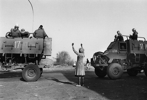 Figure 3 A woman protests against the presence of soldiers in the townships, Soweto 1985. Photograph by Paul Weinberg, reproduced courtesy of the photographer.