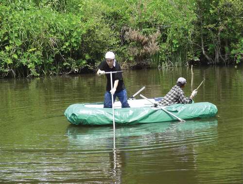 Figure 2. Sampling of sedimentary soil at the bottom of the pond