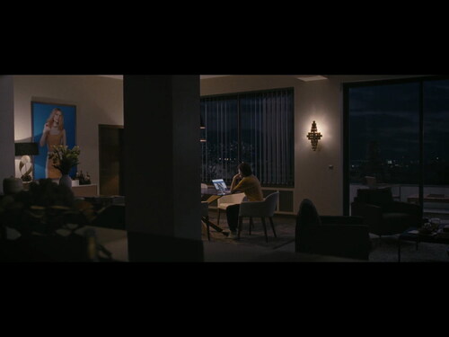Figure 2. Absent presences: Maureen (Kristen Stewart) alone at Kyra’s flat.