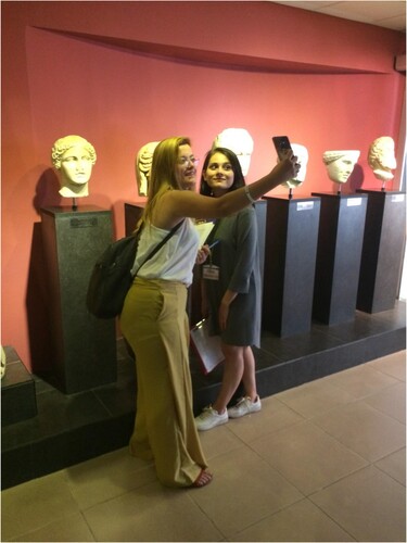 Figure 8. Trainee teachers posing for a ‘selfie’ with statues in Fethiye Museum. (Photo credit: Gülşen Yegen for FETAV).