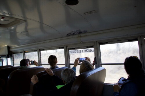 Visitors from the Sierra Club onboard a bus and observing the Tar Creek Superfund Site during a toxic tour in 2018. Credit: Clifton Adcock.