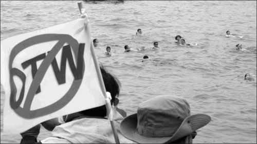 “From the streets of Cancun (Mexico), in 2003, to Hong Kong in 2005, Korean farmers led the popular resistance to the WTO negotiations.” In the WTO demonstration pictured above, 80 Korean farmers attempted to swim to the site of the WTO convention in Hong Kong in 2005 to protest WTO policies. (Courtesy: Scoop.co.nz)