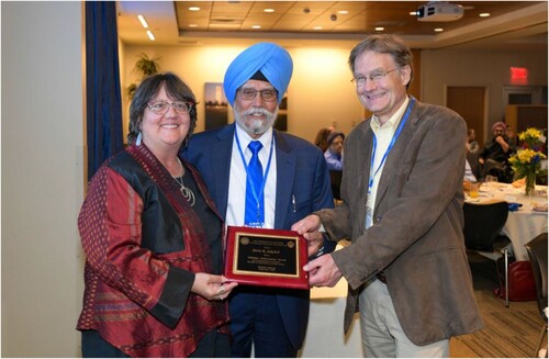 Figure 3. Doris Jakobsh receiving her Lifetime Achievement Award for her contribution to the field of Gender Studies in the Sikh tradition from Verne A. Dusenbery and Pashaura Singh.