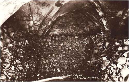 Figure 2. Medieval configuration of the charnel crypt at Holy Trinity, Rothwell, prior to restacking in 1912. Bones stacked against walls created central space, while fresco remnants are visible on the rear wall. Unpublished photograph. Author’s Collection.