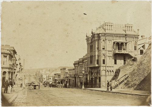 Figure 5. Princes Street by junction of Dowling Street, looking south, c1867-69. The completed Oriental Hotel is on the right. Photographer: J W Allen, 1869. Source: Hocken Collections - UareTaoka o Hākena, University of Otago, P1910-046-006.