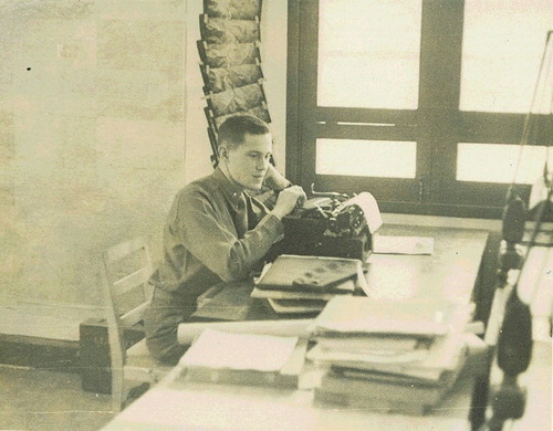 Figure 7. A photograph of Bill Evitt deep in thought while typing up a military report on aerial photograph interpretation as part of his duties with the 18th Photo Intelligence Department (PID) in Kunming, southern China, during World War II. The image is reproduced with the approval of the Evitt family.
