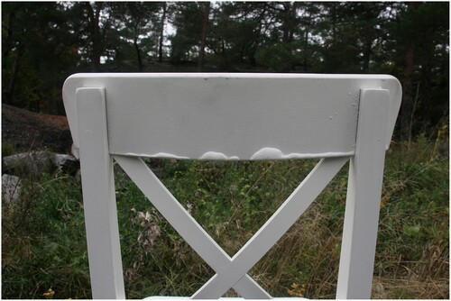 Figure 7. Example of damage after the water test: water damage on painted wooden chair. Minimal covering with gaps on the side allowed humidity to get inside and react, causing the material to swell.