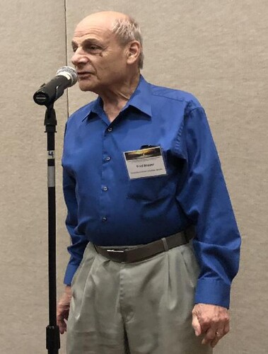 Figure 1. Fred Brauer speaking at a conference in May 2018, encouraging students to have the confidence to reach out and engage with senior researchers. Photo by Zhisheng Shuai.