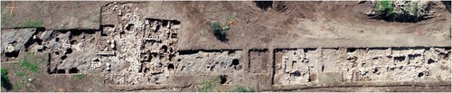 Figure 10 Aerial view of Areas F (right) and G (left), on the Lower Terrace of Ḥorvat Tevet, looking south. Remains of a building (Level 5) and silos (Level 4) are visible in Area G (left). Stone installations for extraction of fluids are visible in Area F (right) (courtesy of the Israel Antiquities Authority, photo by Assaf Peretz).