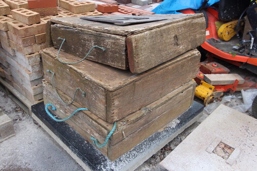 FIG. 4 Wooden headstone boxes used to prevent JCBs from damaging headstones.