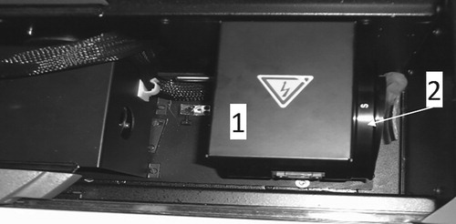 Figure 6. The spectrophotometer chamber with the test sample for which the spectral characteristic of reflection (R(λ)) was measured.Note: 1 = integrating sphere; 2 = test sample.