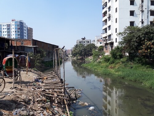 Figure 4. Rickshaws parked next to a drainage canal. Photograph by Annemiek Prins, 2022. CC BY 4.0.