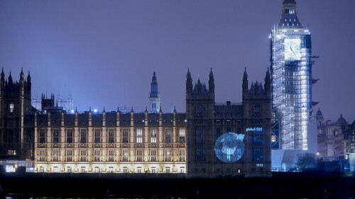 Figure 2. Guerrilla projection, climate data, House of Commons, London, 10 November 2021 (photograph Tom Corby).
