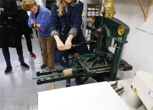 Figure 2. Joanna demonstrating the Albion Press.