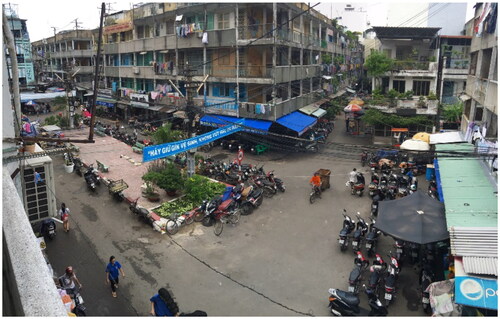 Figure 1. A public park in Chung Cu Nguyen Thien Thuat, now being divided by local residents into plots for private parking services (photographed by the authors, 2016).