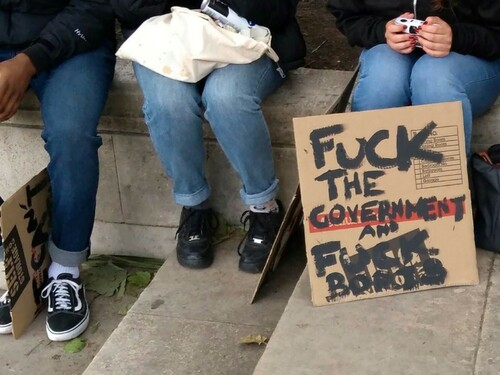 Figure 3. A protest sign reading ‘Fuck the Government and Fuck Boris’ [Johnson], at the feet of protesters preparing to go home for the day. Author’s photo.