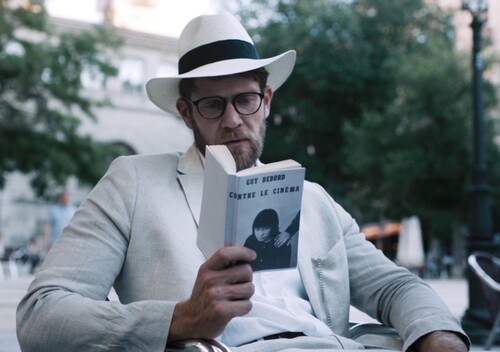 Figure 4. Mariano (Colby Keller), a suicidal professor on sabbatical, reads philosophy and ponders his existence.