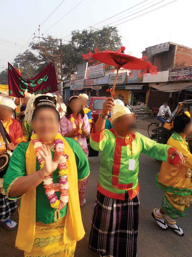 Figure 2. The weikza-lam pilgrims dancing through Bodh Gaya on their way to the opening of the Tipiṭaka festival. (Source: Authors)