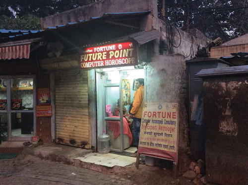 Figure 2. A traditional fortune teller’s business in New Delhi, India, in 2017. As customers are sensitized for transformatory life events ahead, their psychosocial dependencies on past certainties is reduced and their capability to accept loss and absorb adversity is enhanced. Photograph: Cornelius Holtorf.