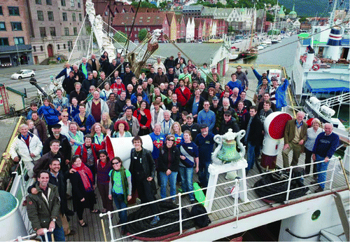 Group picture of ICWL Bergen attendees at bow of SS Str. Lehmkuhl.