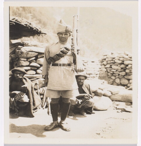 Figure 6. An Afridi sentry of the frontier constabulary with kohistani prisoners, 1934, NATIONAL army museum number: 136247, image number: 136247 (Photograph by Lieutenant L H Landon, Royal Artillery, India, North West Frontier, 1934.).Footnote28