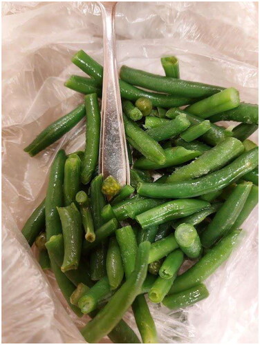 Figure 1. Remnants of the eaten green beans from Case 1 in which several berries (later identified as berries from Solanum nigrum) can be spotted.