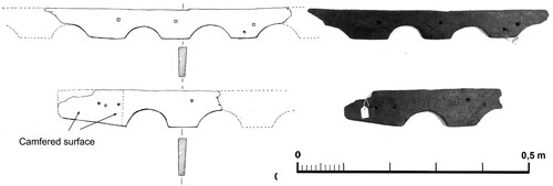 Figure 16. Two fragments of a railing with semi-circular cutaways were found loose in the ship’s bow. (Niklas Eriksson).