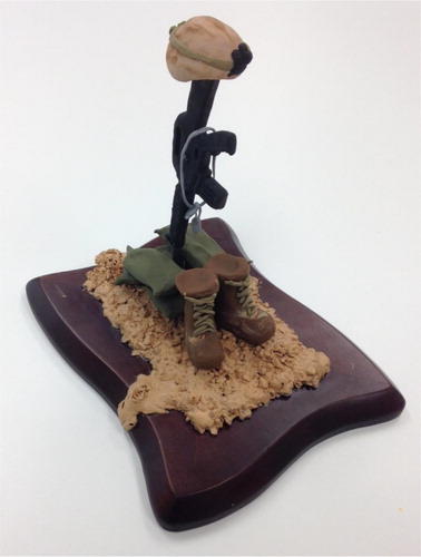 Figure 10. Mixed media artwork. A marine created this mixed media battlefield cross sculpture to memorialise a best friend and comrade who was killed in action. Creating the memorial allowed him to feel he paid his respects.