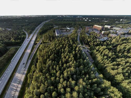 Figure 3. A panoramic aerial view towards the north shows the relation of the site to the downtown Oulu and suburban development. Photo: Janne Ikäheimo.