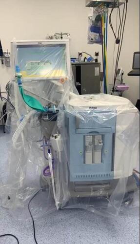 Figure 2 Anaesthesia for a COVID-19 patient. All equipment in the operating room were covered with a plastic drape to decrease contamination.