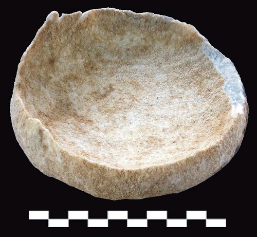 Figure 12. Remains of eroded calcite or travertine vessel.