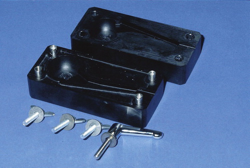 Figure 1. Mold, consisting of polyoxymethylene (POM), for standardized production of hip spacers. Each spacer has a head diameter of 50 mm, a stem length of 10 cm, and a total surface area of 13,300 mm2.