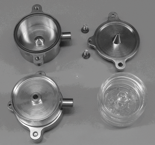 FIG. 6 The SADS (lower left) built according to the optimization procedure has the outer shape of 37 mm cassette (lower right) and consists of two pieces, the air nozzle (upper left) and collection probe (upper right).