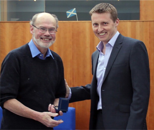 Figure 2 Colin Ballantyne (left) receiving the Coppock Research Medal of the Royal Scottish Geographical Society from Mike Robinson, RSGS Executive Director.