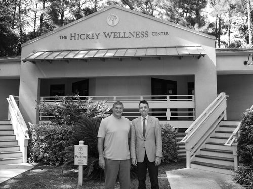 Figure 1.  Dr. Joe Hickey (left) and Dr. Bedlack in front of the Hickey Wellness Center.