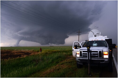 Fig. 9 RaXPol, a rapid-scan, X-band, polarimetric mobile Doppler radar scanning a tornado in Kansas in 2016. Courtesy of H. Bluestein.