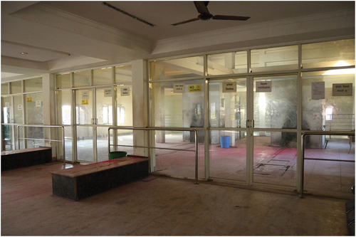 Figure 4. View inside the PADT electric crematorium with the two electric furnaces behind the dividing glass wall. Photo by author, 2017.