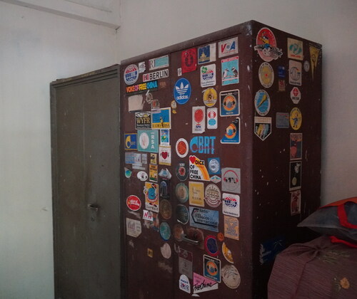 Figure 2 Cupboard in Badri Prasad Verma Anjaan’s homestead with stickers sent by different radio stations, Photo: April 11, 2022, Jyothidas KV ©Bajpai.