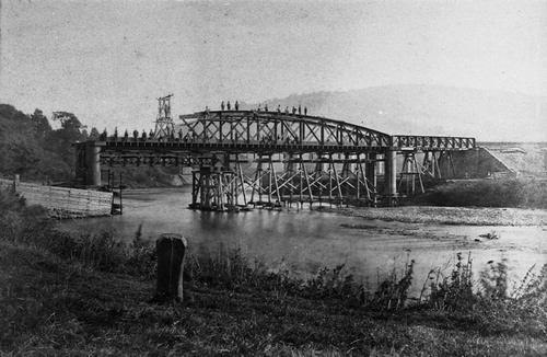 FIGURE 5. Erection of bridge over River Wye, Monmouth, 1873, supported by timber piles and using traveller. Courtesy Chepstow Museum