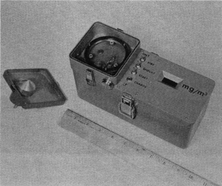 FIG. 44 GCA respirable dust monitor (inlet removed and inverted to show impactor nozzle and impaction plate) (CitationLilienfeld and Dulchinos 1972) [Reprinted with permission].