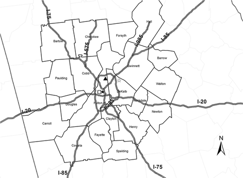 Figure 1. Atlanta metropolitan statistical area with counties, major highways, and monitoring stations studied (monitors: filled triangle, AQS CO station ROS; filled star, AQS NOx station GT; open star, AQS NOx station TUC; open square, SEARCH CO and NOx station JST).