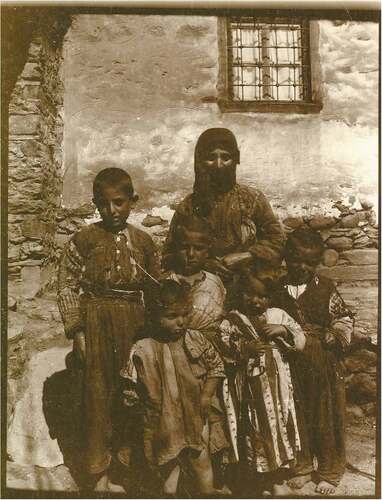 Figure 2. ‘Heghin with her 5 sons, two were received into the orphanage. Burned in their house during the murders in Mush in 1915. Helped us in the orphanage with her son. She was a good woman of faith’ Source: Riksarkivet Norge, https://commons.wikimedia.org/wiki/Category:Wikimedia_Norge_Bodil_Biørn_project#/media/File:Armenisk_enke_med_barn_-_fo30141712180002.jpg.