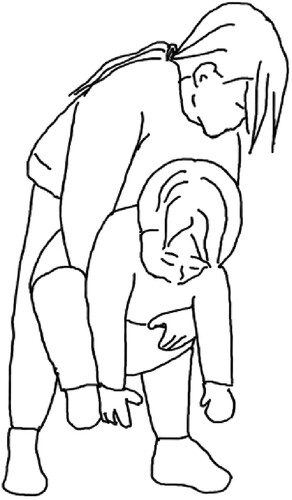 Figure 13. Older child lifts younger child.