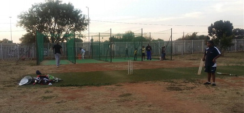 Figure 6. Children learning to play cricket.