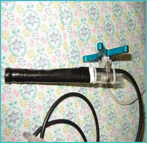 Figure 2. A prototype of the metal detector. The apparatus included a plastic tube, a coil wound at the tip, and a tracking array which was used by the navigation system (StealthStation® TREON® plus).