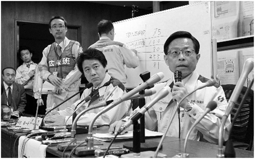 Figure 7. A picture of the Nuclear Industry Safety Agency (under the umbrella of METI) during a press conference in the midst of the Fukushima Dai'ichi accident. The agency was widely criticized for lack of Accountability during and after the accident (Utsukushii chikyū kankyō wo mamoru tame ni ikimono jakusha ni shien wo, Citation2012)