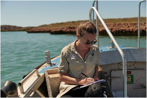 Figure 1. The author recording a survey log at Cape Bruguieres Channel in Murujuga during the Deep History of Sea Country project (Photograph: S. Wright).